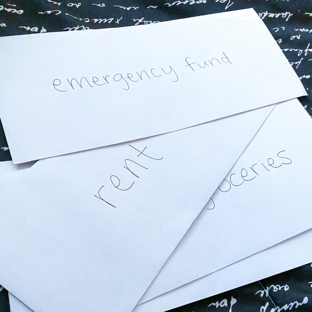 envelopes with different expenses written on them