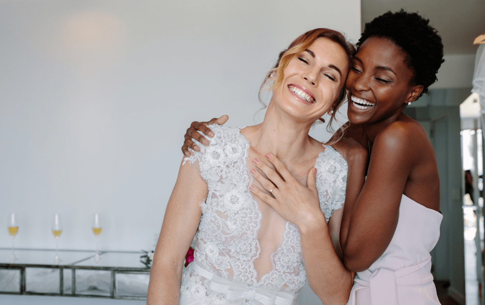 smiling bride and bridesmaid
