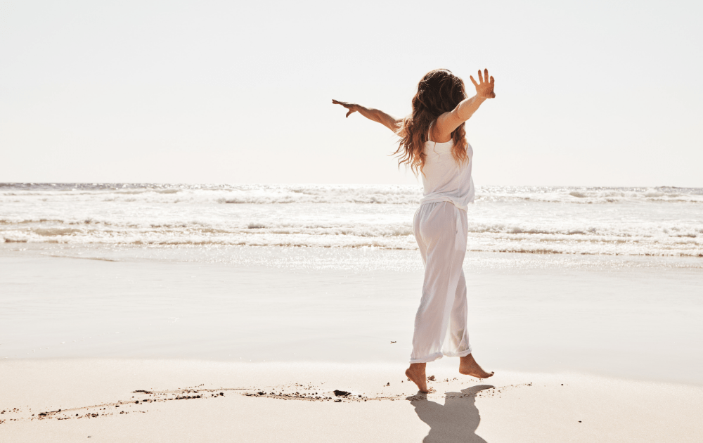 free-spirited woman on a beach